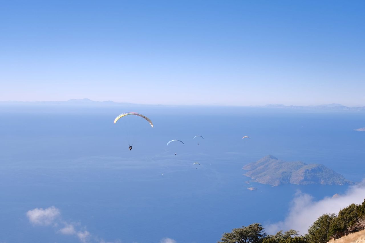 Paraglider flying above the sea and islands off Babadağ