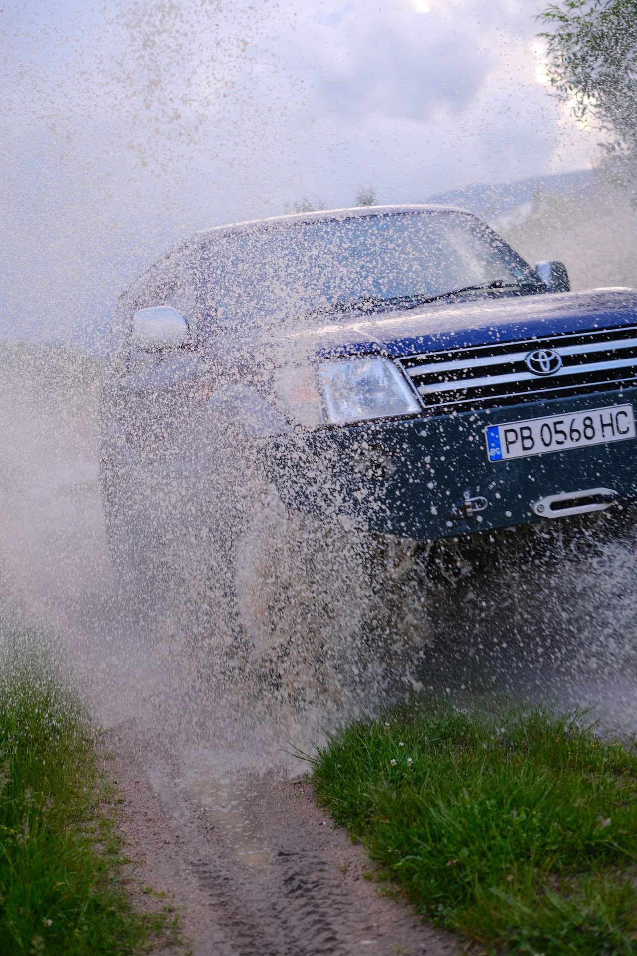 Close view of the vehicle surrounded by suspended water droplets