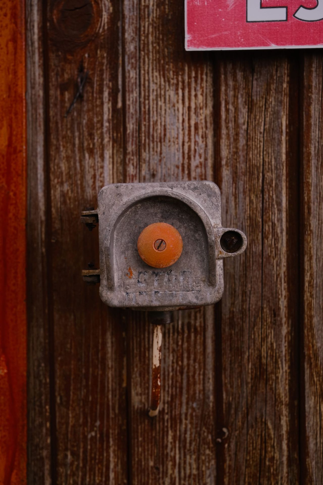 Metal switch box on a weathered wooden door, Bulgaria