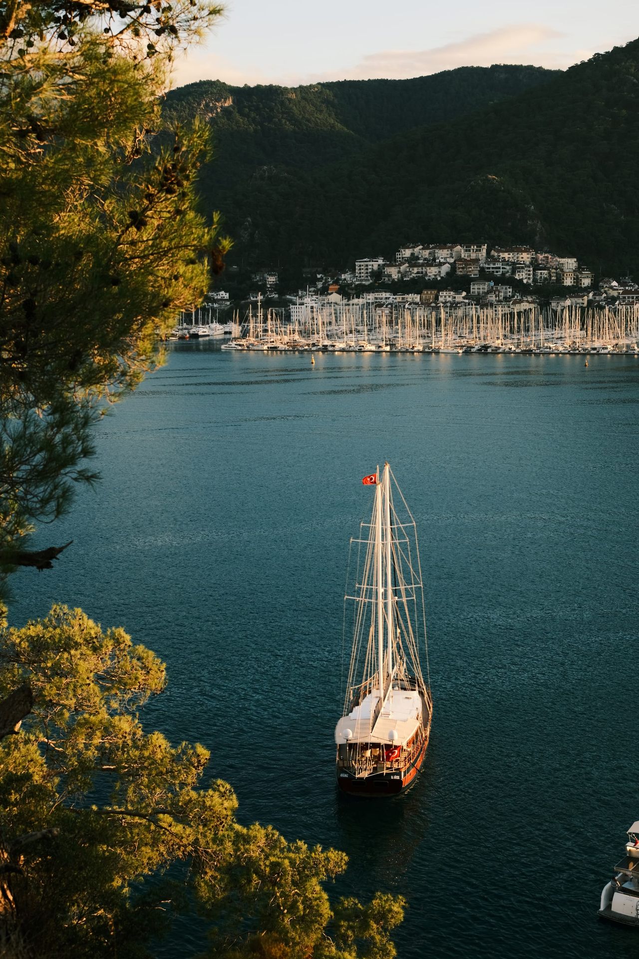 Sailboat anchored in a sheltered turquoise bay near Fethiye