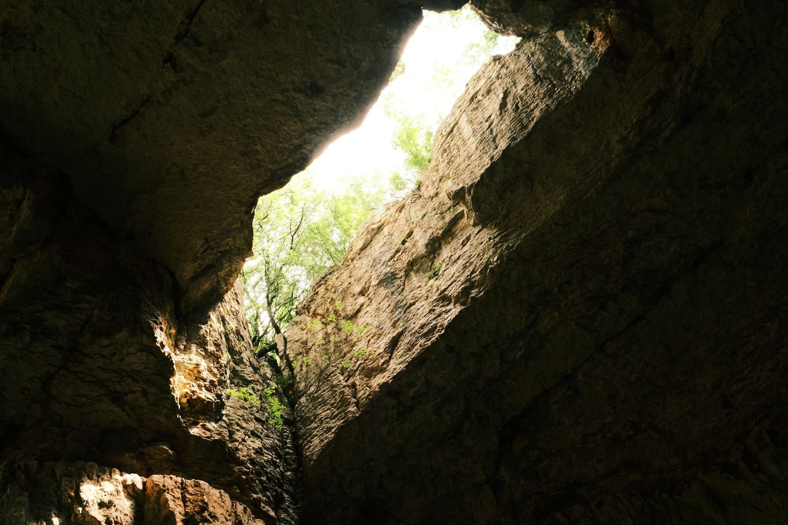 Narrow roof opening framed by dark limestone