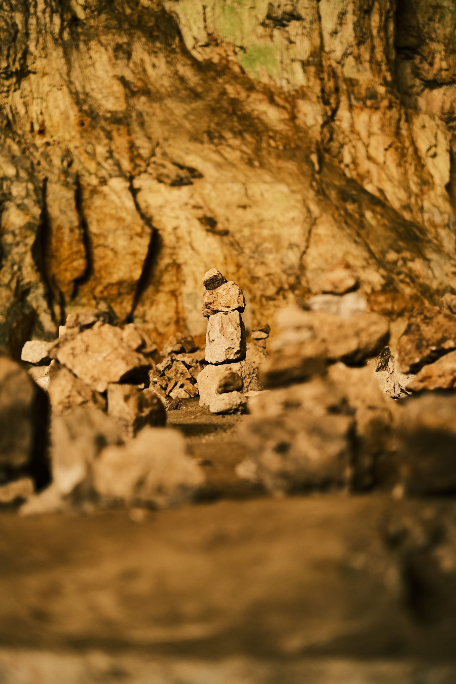 Warm light falling across rocks on the cave floor