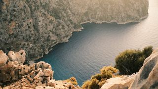 Butterfly Valley cove enclosed by steep limestone cliffs on Turkey’s coast