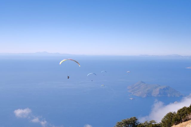 Paraglider flying above the sea and islands off Babadağ