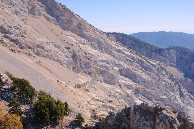 Layered limestone ridge and distant mountains on Babadağ