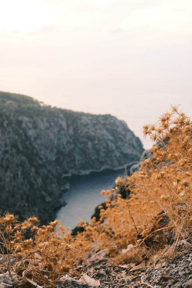 Butterfly Valley cove seen between sunlit rocky slopes